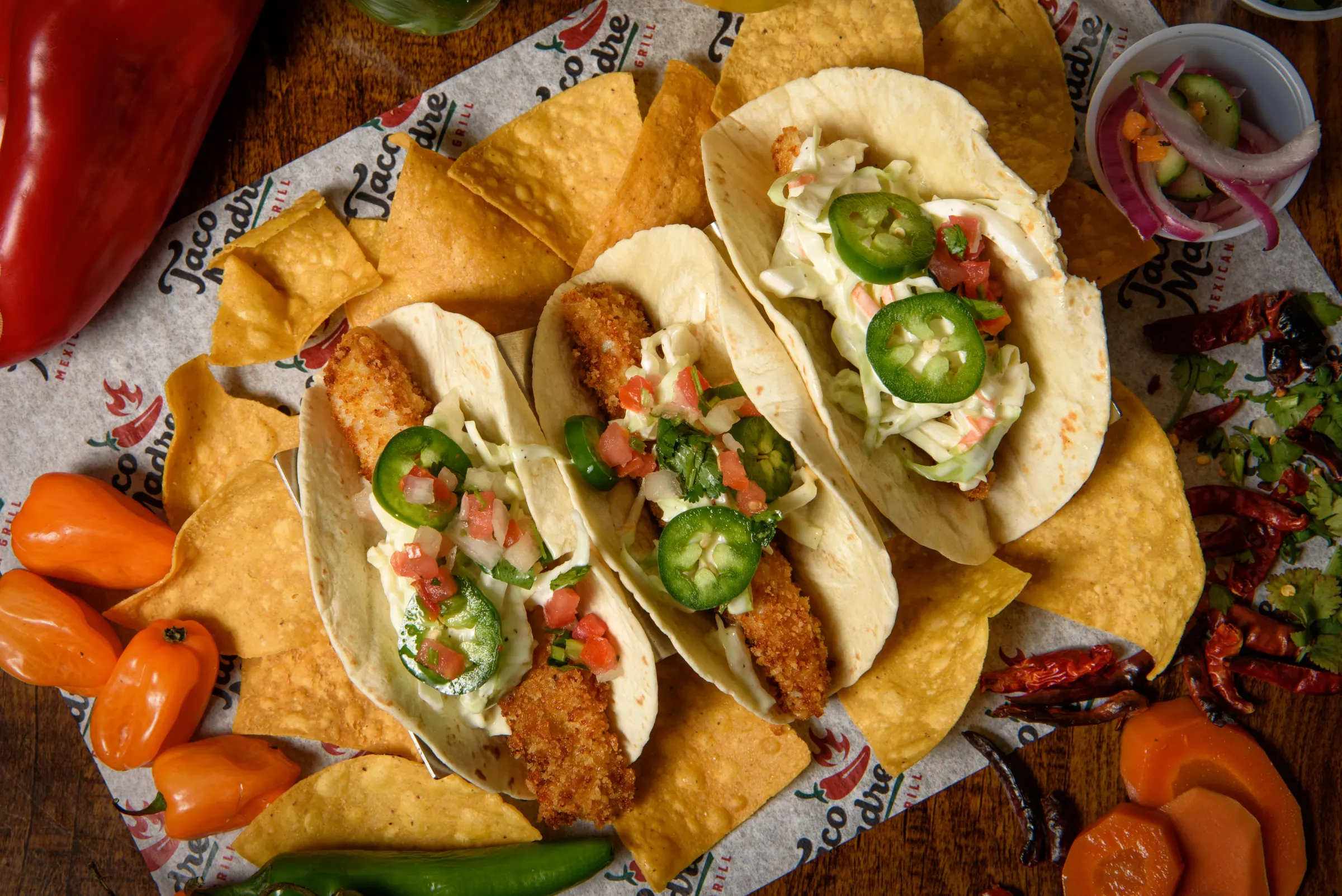 Fish tacos with cabbage and lime on a plate